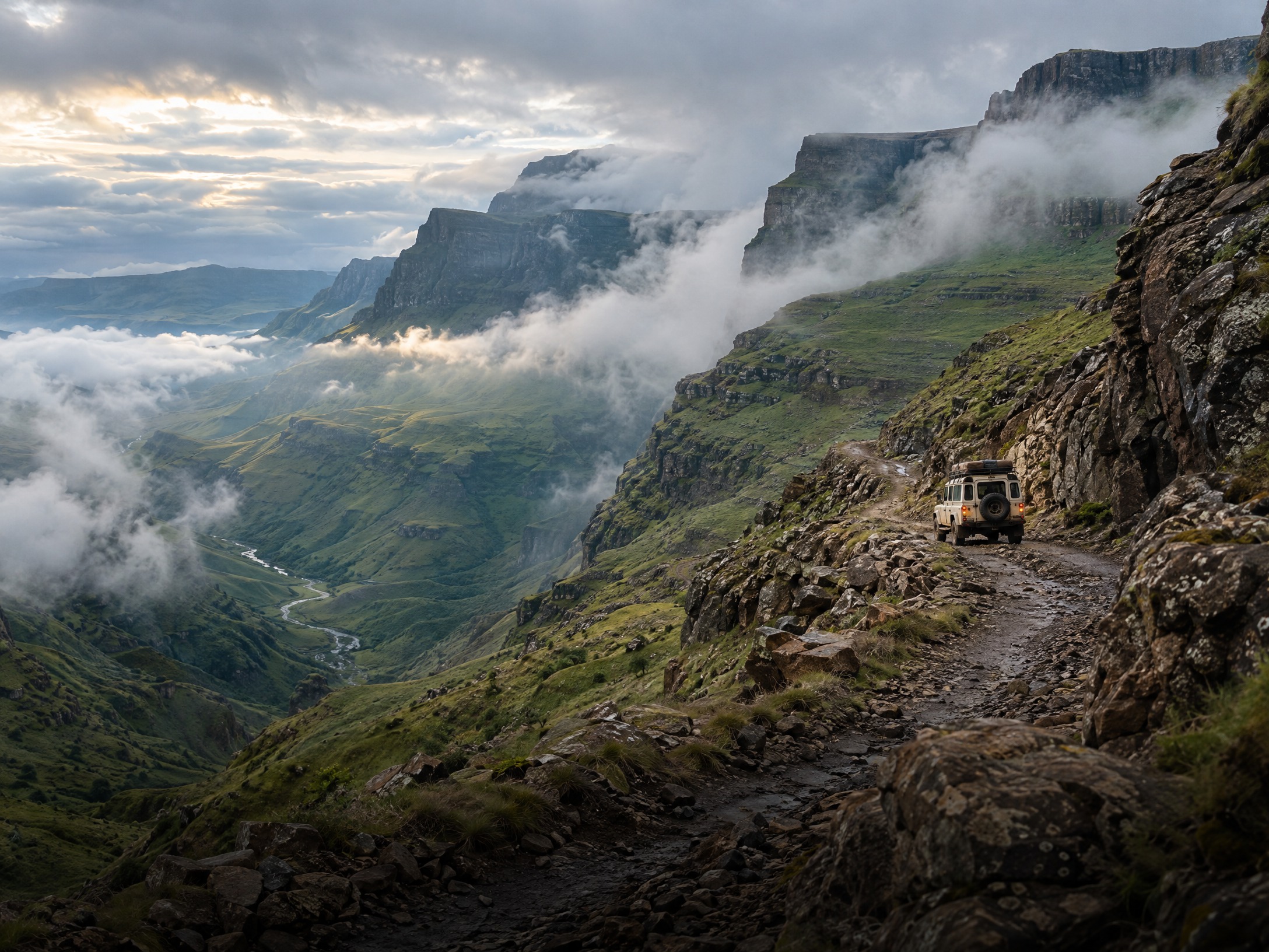 A 4x4 exploring a misty mountain pass